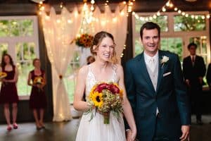 Cailly and Tyler had a rainy wedding day at Millcreek Barn in Michigan. Cailly wore a beautiful and unique wedding dress from Truvelle.