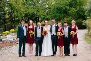 Cailly and Tyler had a rainy wedding day at Millcreek Barn in Michigan. Cailly wore a beautiful and unique wedding dress from Truvelle.