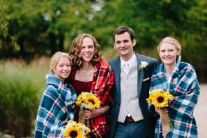 Cailly and Tyler had a rainy wedding day at Millcreek Barn in Michigan. Cailly wore a beautiful and unique wedding dress from Truvelle.