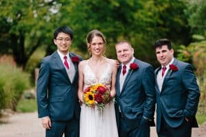 Cailly and Tyler had a rainy wedding day at Millcreek Barn in Michigan. Cailly wore a beautiful and unique wedding dress from Truvelle.