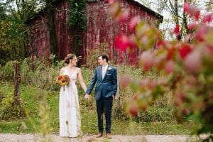 Cailly and Tyler had a rainy wedding day at Millcreek Barn in Michigan. Cailly wore a beautiful and unique wedding dress from Truvelle.