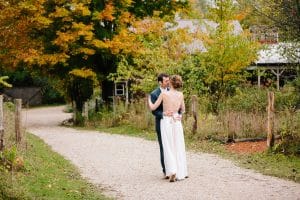Cailly and Tyler had a rainy wedding day at Millcreek Barn in Michigan. Cailly wore a beautiful and unique wedding dress from Truvelle.
