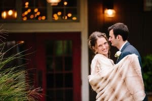 Cailly and Tyler had a rainy wedding day at Millcreek Barn in Michigan. Cailly wore a beautiful and unique wedding dress from Truvelle.