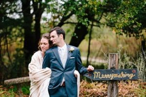 Cailly and Tyler had a rainy wedding day at Millcreek Barn in Michigan. Cailly wore a beautiful and unique wedding dress from Truvelle.