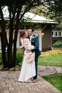 Cailly and Tyler had a rainy wedding day at Millcreek Barn in Michigan. Cailly wore a beautiful and unique wedding dress from Truvelle.