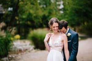 Cailly and Tyler had a rainy wedding day at Millcreek Barn in Michigan. Cailly wore a beautiful and unique wedding dress from Truvelle.