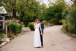 Cailly and Tyler had a rainy wedding day at Millcreek Barn in Michigan. Cailly wore a beautiful and unique wedding dress from Truvelle.