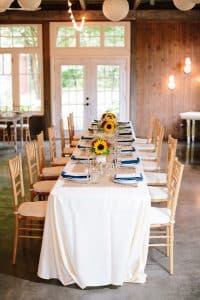 Cailly and Tyler had a rainy wedding day at Millcreek Barn in Michigan. Cailly wore a beautiful and unique wedding dress from Truvelle.