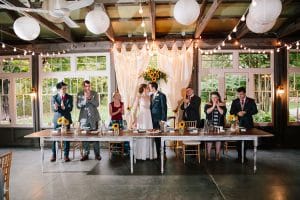 Cailly and Tyler had a rainy wedding day at Millcreek Barn in Michigan. Cailly wore a beautiful and unique wedding dress from Truvelle.