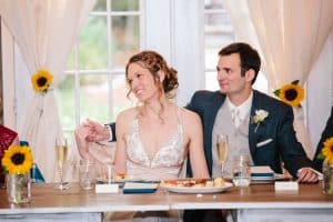 Cailly and Tyler had a rainy wedding day at Millcreek Barn in Michigan. Cailly wore a beautiful and unique wedding dress from Truvelle.