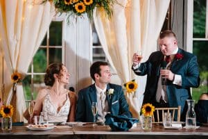 Cailly and Tyler had a rainy wedding day at Millcreek Barn in Michigan. Cailly wore a beautiful and unique wedding dress from Truvelle.