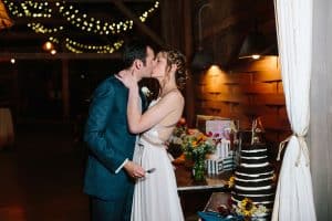 Cailly and Tyler had a rainy wedding day at Millcreek Barn in Michigan. Cailly wore a beautiful and unique wedding dress from Truvelle.