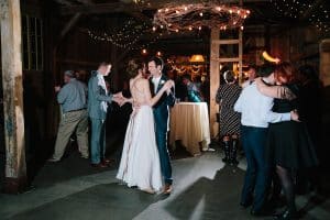 Cailly and Tyler had a rainy wedding day at Millcreek Barn in Michigan. Cailly wore a beautiful and unique wedding dress from Truvelle.