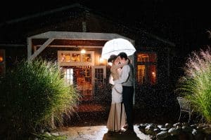 Cailly and Tyler had a rainy wedding day at Millcreek Barn in Michigan. Cailly wore a beautiful and unique wedding dress from Truvelle.