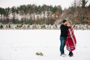 The first Michigan snowfall was the perfect backdrop for this engagement session in Grand Rapids at Vormittag Tree Farm.