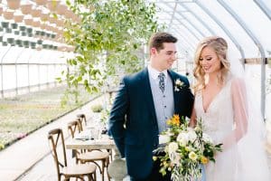 This Greenhouse wedding was photographed in Grand Rapids, MI. The inspiration includes a french bulldog, beautiful blooms, and endless wedding photo inspiration.