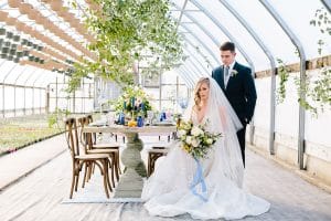 This Greenhouse wedding was photographed in Grand Rapids, MI. The inspiration includes a french bulldog, beautiful blooms, and endless wedding photo inspiration.