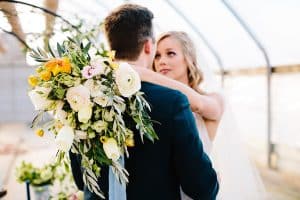 This Greenhouse wedding was photographed in Grand Rapids, MI. The inspiration includes a french bulldog, beautiful blooms, and endless wedding photo inspiration.