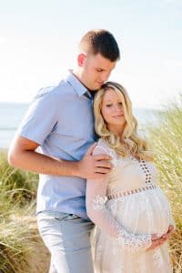Holland Michigan maternity photos at Tunnel Park. Whitley wore a beautiful white lace gown.