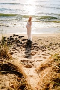 Holland Michigan maternity photos at Tunnel Park. Whitley wore a beautiful white lace gown.