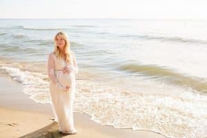 Holland Michigan maternity photos at Tunnel Park. Whitley wore a beautiful white lace gown.