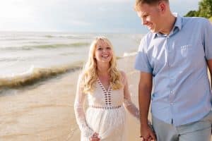 Holland Michigan maternity photos at Tunnel Park. Whitley wore a beautiful white lace gown.