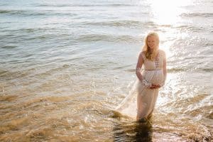 Holland Michigan maternity photos at Tunnel Park. Whitley wore a beautiful white lace gown.