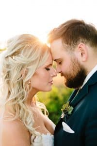 A Michigan wedding with a cathedral veil and golden hour light.
