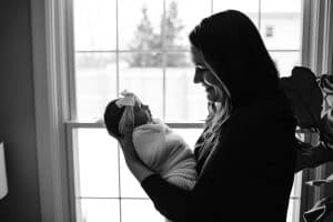 Meghan and Chandler welcomed their baby girl, Eleanor into the world and had it documented in Grand Rapids with an in home newborn session by Mae Photo Co.