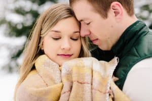 A winter engagement session in Grand Rapids, MI photographed by Mae Photo Co at Provin Trails, Aquinas college, and wealthy street bakery.