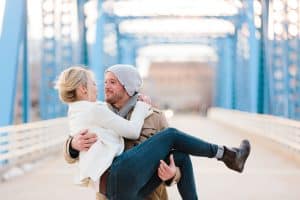 A blue bridge engagement session in Grand Rapids, Michigan. Photographed by Mae Photo Co.