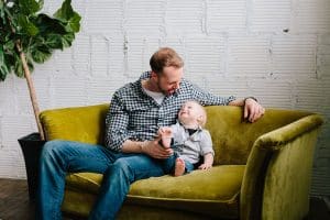 A one year old boy with his dad photographed in Grand Rapids, Michigan by Mae Photo Co.