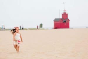 A holland state park beach family photo session by Mae Photo Co.