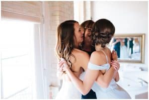 Bride hugging her maid of honor
