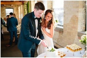 Bride and groom cut their cake at the Harbourfront place in Grand Haven