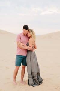 Silver Lake Sand Dunes Engagement Session with couple hugging in the daylight