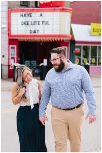 downtown Grand Haven engagement photo session by the theatre.