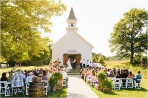 A wide photo of the chapel at the Felt Estate during a wedding ceremony.