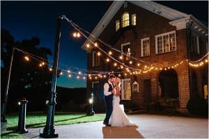 A night portrait photographed at the Felt mansion during a bride and grooms reception on their wedding day.