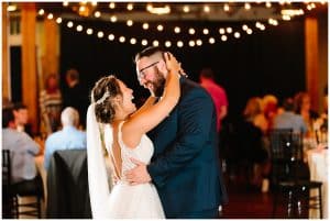 Photograph of a bride and groom dancing after their wedding ceremony.