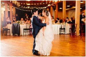 A bride dancing with her father at her wedding.