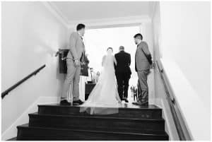 A bride standing at the entrance of her ceremony before walking down the aisle.