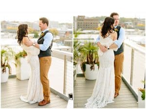 A bride and groom laughing and smiling together as they stand outside on a balcony.