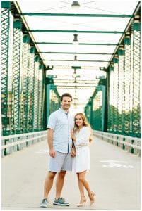 Engagement photos taken in front of the Blue bridge in Grand Rapids, Michigan.